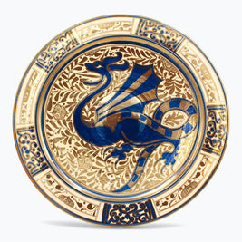 Plato de dragón en reflejo metálico