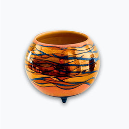 Vasija esférica de reflejo metálico con lustre naranja y azul